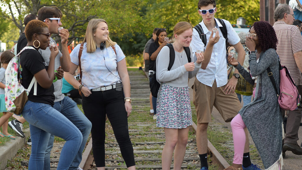 Students enjoying ice cream outside