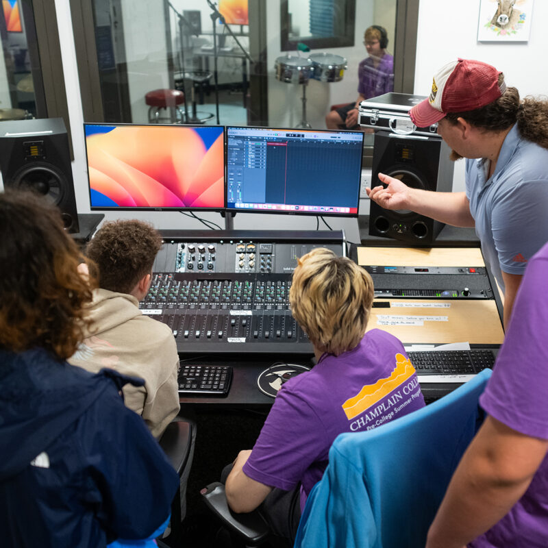 Audio Engineering professor instructing students in recording studio