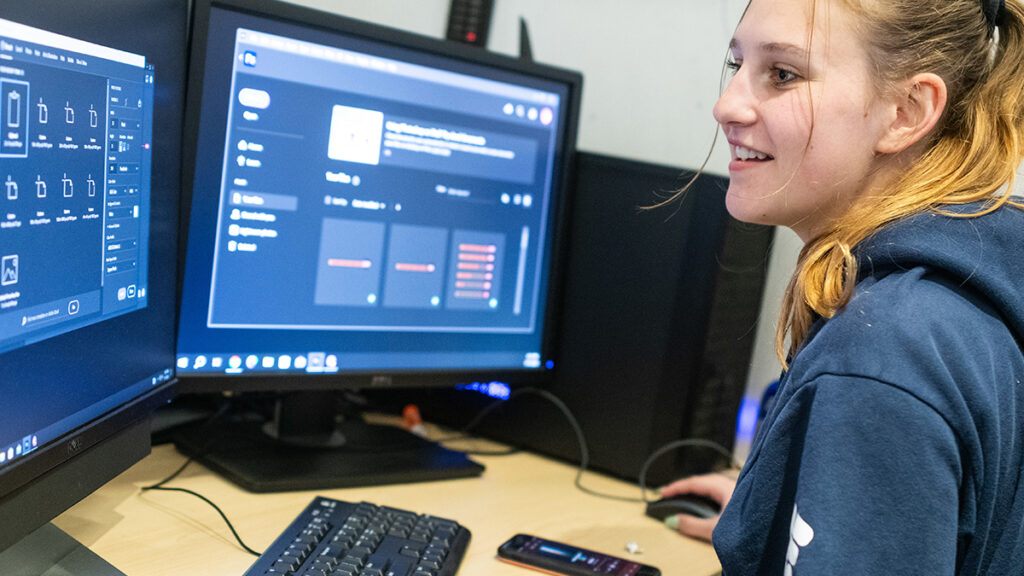 Smiling student working on project in Game Academy