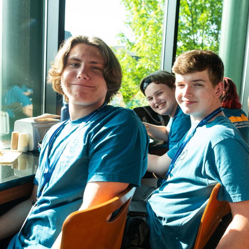 Three Game Academy Students smiling at camera