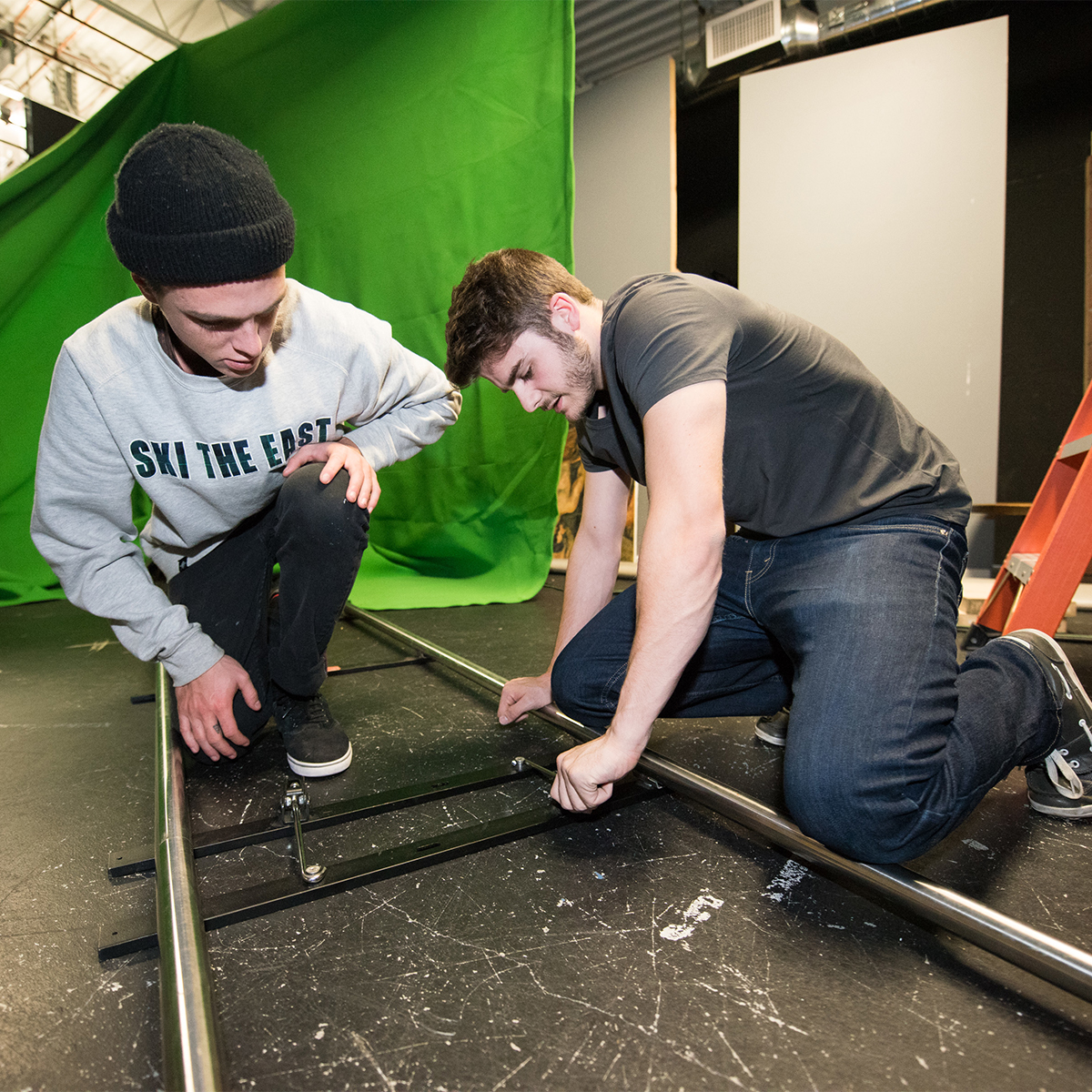 Students working on a broadcast production set