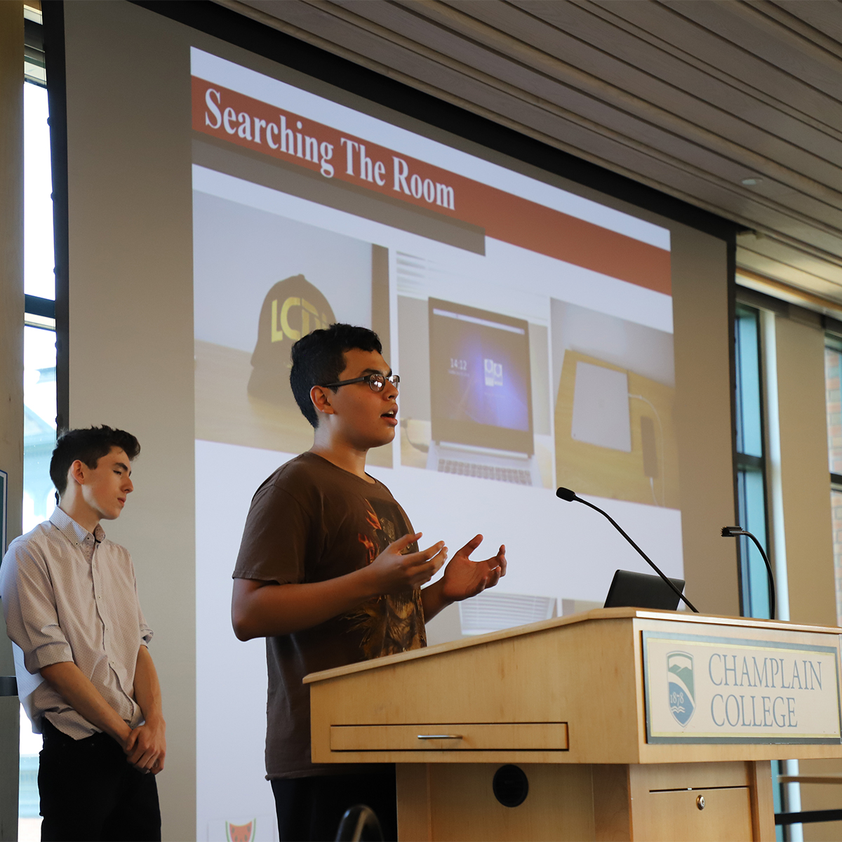 Student presenting at a podium