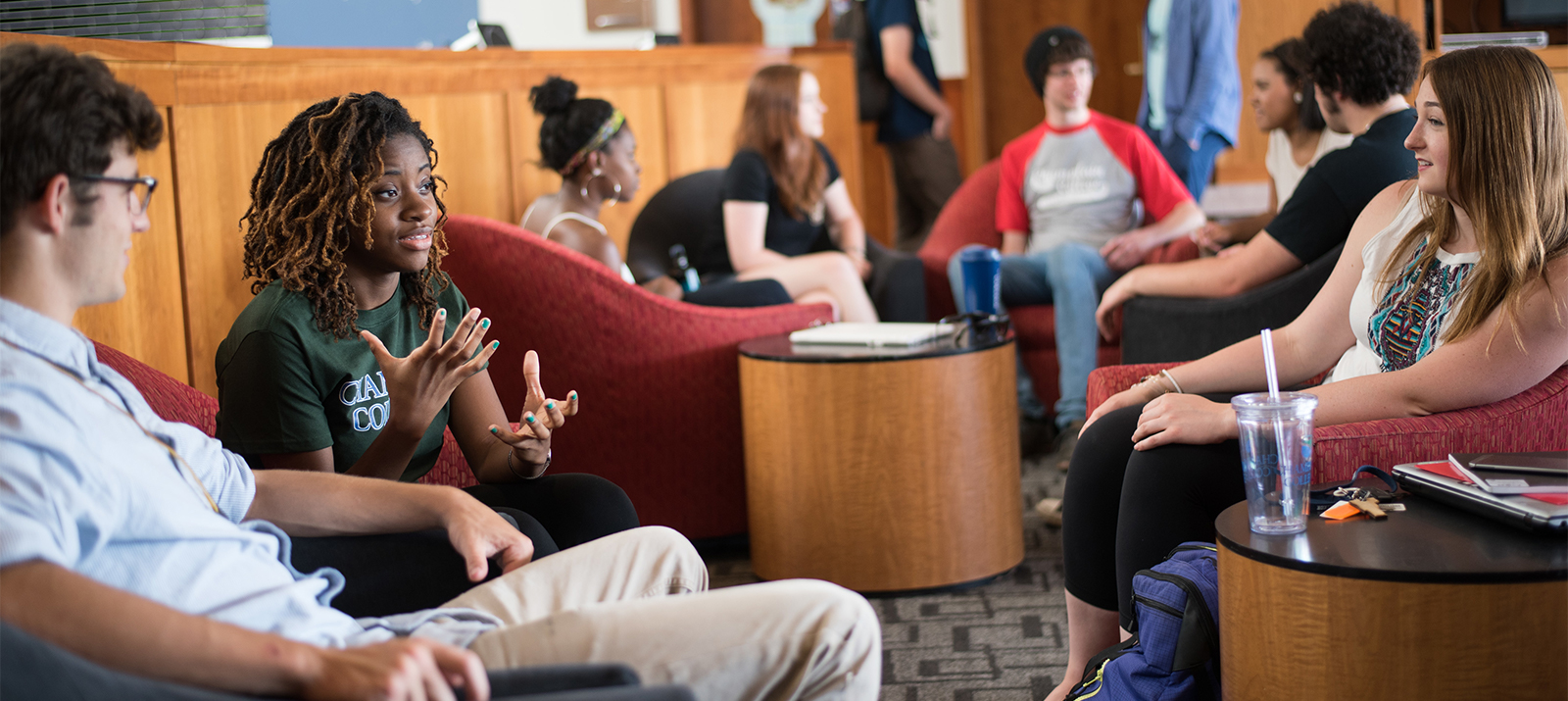 Students talking in a large room